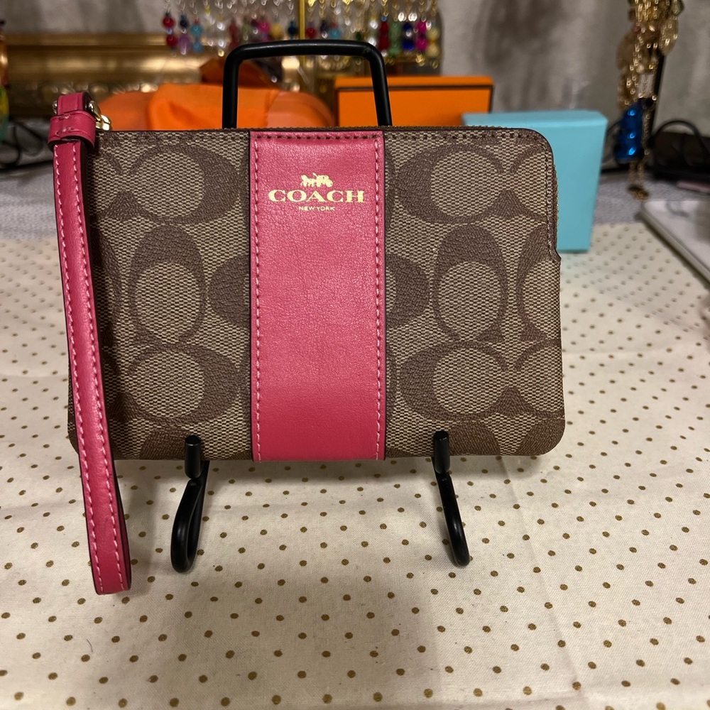 NWOT Coach wristlet. Coated canvas. Leather trim.